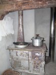 This stove is powered by the burning of wood behind the little door on the right.