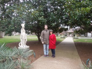 with my husband, next to a magnolia tree